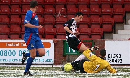 Ryan Esson rushes out at Dunfermline
