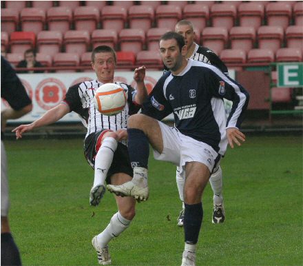 Joe Cardle challenges for the ball v Dundee