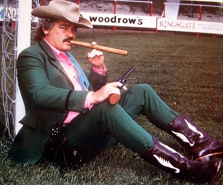 Jim Leishman in boots with cigar