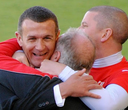 Jim McIntyre celebrates with Gerry McCabe and Kenny Murray